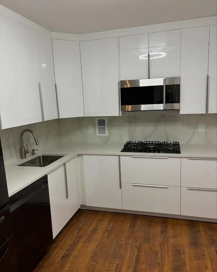 Restored kitchen with white cabinets after water damage in Silver Lake